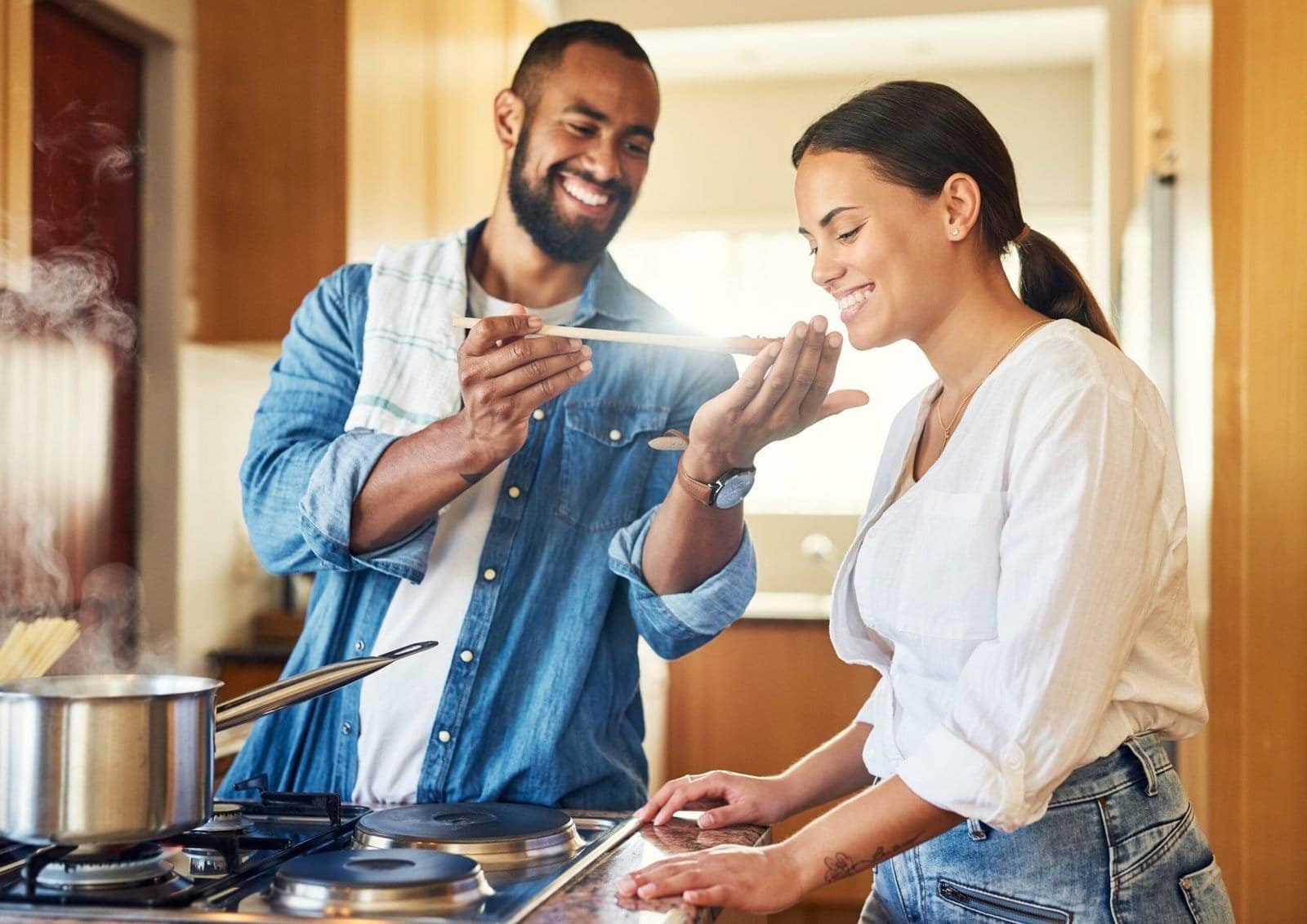 Couple enjoying quality time cooking together, emphasizing the importance of balanced nutrition and a healthy lifestyle