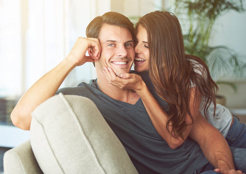 a man and woman sitting on a couch - Is MACA his new found source for increased Libido?