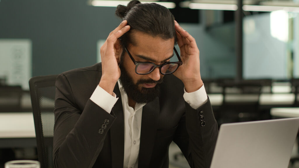 Stressed Man at work - could adding L-theanine into your routine help cognitive function?