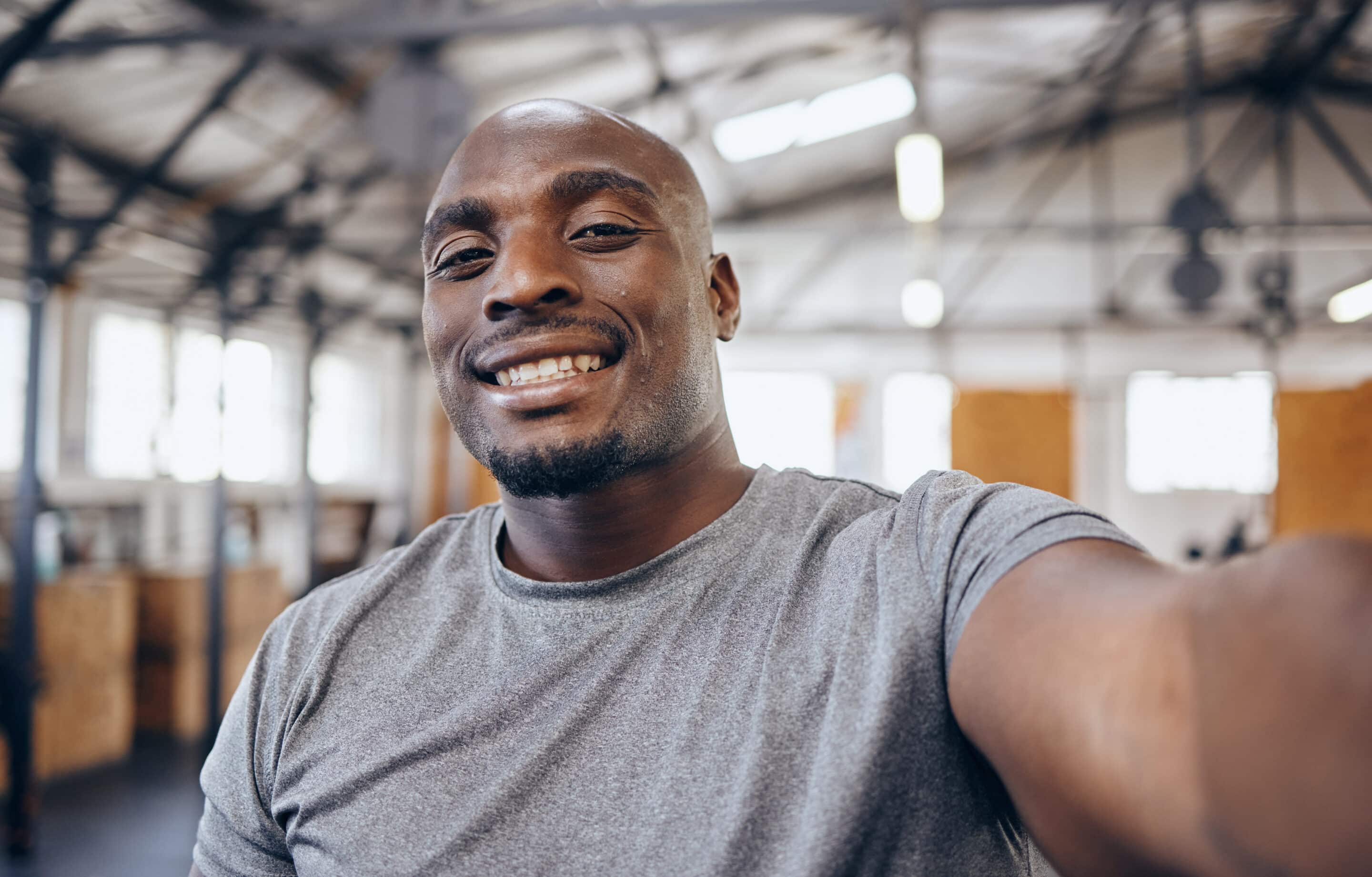 Athletic African American smiling at the gym.